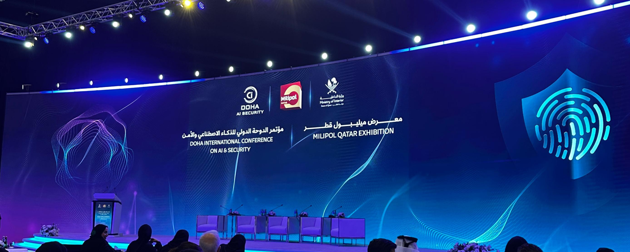 Stage at Milipol Qatar and the Doha International Conference on AI & Security, displaying Milipol Qatar and Qatar Ministry of Interior branding.
